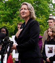 Elizabeth Whelan, sister of US Marine Corps veteran and Russian prisoner Paul Whelan, speaks at a news conference alongside families of Americans being held hostage or wrongfully detained overseas in Lafayette Park near the White House, in Washington, DC, in May 2022.
Mandatory Credit:	Patrick Semansky/AP/File