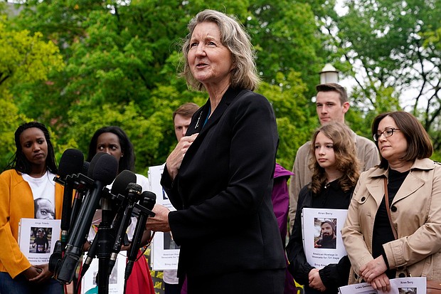 Elizabeth Whelan, sister of US Marine Corps veteran and Russian prisoner Paul Whelan, speaks at a news conference alongside families of Americans being held hostage or wrongfully detained overseas in Lafayette Park near the White House, in Washington, DC, in May 2022.
Mandatory Credit:	Patrick Semansky/AP/File