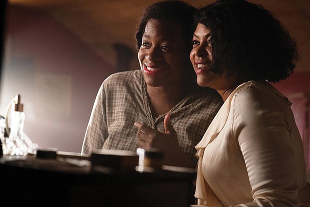 Fantasia Barrino, left, plays Celie and Taraji P. Henson is Shug in Blitz Bazawule’s stirring “The Color Purple,” adapted from the Tony-winning Broadway production.