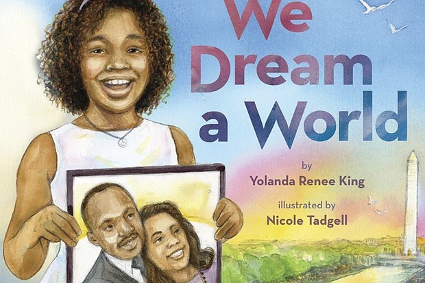 This cover image released by Scholastic shows “We Dream a World” by Yolanda Renee King, granddaughter of Coretta Scott King and Martin Luther King Jr. The book was released on Jan. 2.