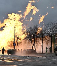 Ukrainian firefighters attempt to extinguish a fire after a missile strike in Kyiv on January 2, 2024, amid the Russian invasion of Ukraine.
Mandatory Credit:	Genya Savilov/AFP/Getty Images