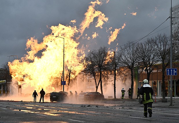 Ukrainian firefighters attempt to extinguish a fire after a missile strike in Kyiv on January 2, 2024, amid the Russian invasion of Ukraine.
Mandatory Credit:	Genya Savilov/AFP/Getty Images