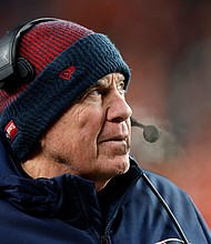 Bill Belichick looks on during the New England Patriots' game against the Denver Broncos. Belichick is leaving the New England Patriots after 24 seasons and winning six Super Bowl titles with the team, according to multiple reports.
Mandatory Credit:	Danielle Parhizkaran/The Boston Globe/Getty Images