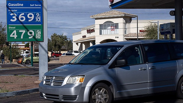 Prices fell in December as inflation continues to moderate. Pictured is a Chevron gas station on January 4, in Phoenix.
Mandatory Credit:	Antranik Tavitian/The Republic/USA Today Network