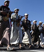 Newly recruited fighters who joined a Houthi force intended to be sent to fight in support of Palestinians in Gaza march in Sanaa, Yemen, December 2.
Mandatory Credit:	Khaled Abdullah/Reuters
