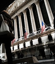 People walk by the New York Stock Exchange in the Financial District on March 7, 2023.
Mandatory Credit:	Spencer Platt/Getty Images