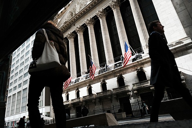 People walk by the New York Stock Exchange in the Financial District on March 7, 2023.
Mandatory Credit:	Spencer Platt/Getty Images