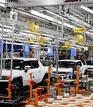 Hummer EV are seen on the production line as US President Joe Biden tours the General Motors 'Factory ZERO' electric vehicle assembly plant, in Detroit, Michigan, on November 17, 2021.
Mandatory Credit:	Jonathan Ernst/Reuters/FILE