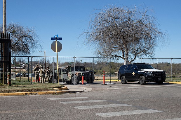 Texas National Guard troops control who enters and exits Shelby Park at the US-Mexico border in Eagle Pass, Texas, on January 12.
Mandatory Credit:	Kaylee Greenlee Beal/Reuters