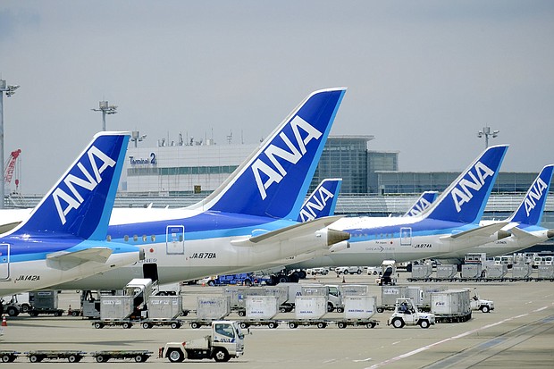 All Nippon Airways (ANA) airplanes are seen here at the Tokyo International Airport in November 2021. A domestic flight operated by ANA returned to its departure airport on January 13 after a crack was found in a window.
Mandatory Credit:	James Matsumoto/SOPA Images/LightRocket/Getty Images