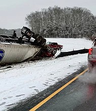 A tractor trailer hauling 40,000 pounds of bananas rolled over, closing I-95 ramp in Stonington, Connecticut.
Mandatory Credit:	WFSB