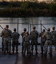 National Guard soldiers stand guard on January 12 on the banks of the Rio Grande at Shelby Park in Eagle Pass, Texas. The drowning deaths of a woman and two children from Mexico near the US-Mexico border have magnified the rift between Texas and federal officials.
Mandatory Credit:	Brandon Bell/Getty Images