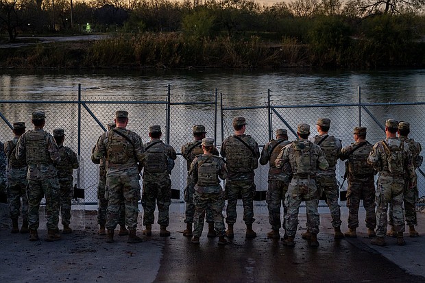 National Guard soldiers stand guard on January 12 on the banks of the Rio Grande at Shelby Park in Eagle Pass, Texas. The drowning deaths of a woman and two children from Mexico near the US-Mexico border have magnified the rift between Texas and federal officials.
Mandatory Credit:	Brandon Bell/Getty Images