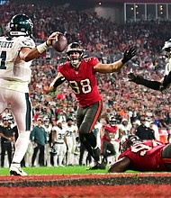 Jalen Hurts of the Philadelphia Eagles throws the ball for an intentional grounding that led to a safety against the Tampa Bay Buccaneers.
Mandatory Credit:	Julio Aguilar/Getty Images