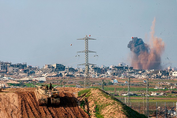 An Israeli tank takes position near the border with Gaza on January 16.
Mandatory Credit:	Menahem Kahana/AFP/Getty Images