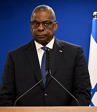 An aide who called 911 requesting an ambulance to Defense Secretary Lloyd Austin’s house on New Year’s Day asked that the ambulance be discreet and “not show up with lights and sirens.”
Mandatory Credit:	Alberto Pizzoli/AFP/Getty Images