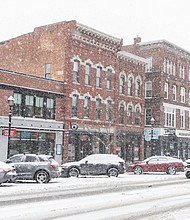 Snow falls on parked cars in Concord, New Hampshire, on January 16.
Mandatory Credit:	Will Lanzoni/CNN