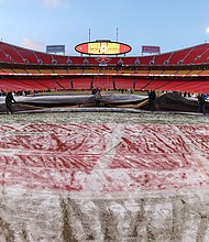 A view of the field at Arrowhead Stadium in Kansas City as the grounds crew removes the cover before the playoff game between the Chiefs and the Dolphins.
Mandatory Credit:	Scott Winters/Icon Sportswire/Getty Images
