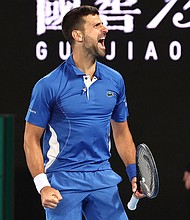 Novak Djokovic celebrates after match point against Alexei Popyrin during their men's singles match in the second round of the Australian Open.
Mandatory Credit:	David Gray/AFP/Getty Images