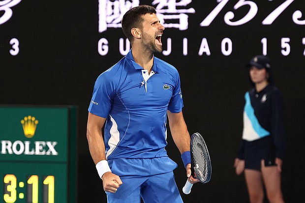 Novak Djokovic celebrates after match point against Alexei Popyrin during their men's singles match in the second round of the Australian Open.
Mandatory Credit:	David Gray/AFP/Getty Images
