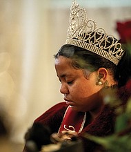 Michelle Wilkerson, VUU’s 2023-2024 Miss 1865, bows her head in prayer during 46th Annual Dr. Martin Luther King Jr. Community Leaders Celebration hosted by Virginia Union University at the Downtown Richmond Marriott on Friday, Jan 12. VUU was founded in 1865.
