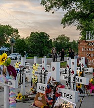 Crosses mark a memorial dedicated to the 19 children and two adults killed during a mass shooting on May 24, 2022, at Robb Elementary School in Uvalde, Texas.
Mandatory Credit:
