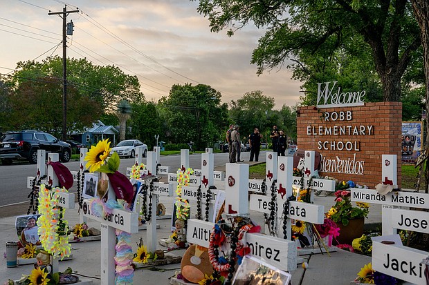 Crosses mark a memorial dedicated to the 19 children and two adults killed during a mass shooting on May 24, 2022, at Robb Elementary School in Uvalde, Texas.
Mandatory Credit: