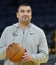 Dejan Milojevic smiles during an NBA preseason basketball game against the Denver Nuggets San Francisco, Friday, Oct. 14, 2022. Golden State Warriors assistant coach Dejan Milojević died January 17 after suffering a heart attack, according to the team. He was 46.
Mandatory Credit:	Jeff Chiu/AP