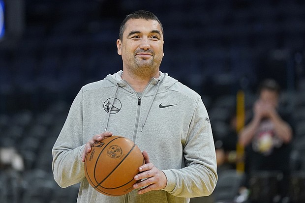 Dejan Milojevic smiles during an NBA preseason basketball game against the Denver Nuggets San Francisco, Friday, Oct. 14, 2022. Golden State Warriors assistant coach Dejan Milojević died January 17 after suffering a heart attack, according to the team. He was 46.
Mandatory Credit:	Jeff Chiu/AP
