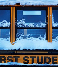 A snow covered school bus sits in a parking lot in Wheeling, Illinois, Tuesday, Jan. 16.
Mandatory Credit:	Nam Y. Huh/AP