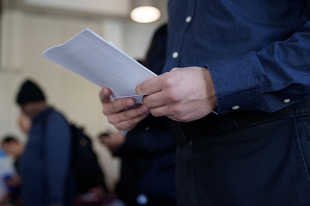 A job seeker attends a Veteran Employment and Resource Fair in Long Beach, California, on January 9. The number of Americans making first-time claims for jobless benefits dropped last week to a level not seen since the fall of 2022.
Mandatory Credit:	Eric Thayer/Bloomberg/Getty Images