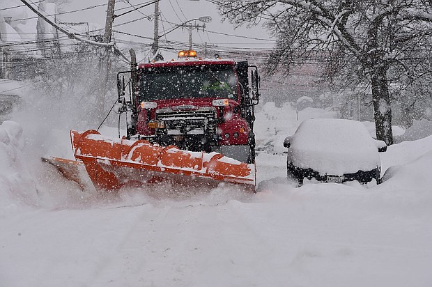 A snow plow clears the streets of heavy snow Thursday in Lackawanna, New York. The suburb of Buffalo was one of the areas hit the hardest by a lake-effect snowstorm this week.
Mandatory Credit:	John Normile/Getty Images