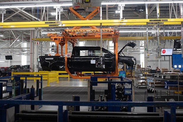 A Ford F-150 Lightning on a production line of the Ford Motor Co. Rouge Electric Vehicle Center (REVC) in Dearborn, Michigan on Sept. 8, 2022. Ford will shut down one of two production shifts in April at the Dearborn, Michigan, factory that builds the F-150 Lightning electric pickup.
Mandatory Credit:	Emily Elconin/Bloomberg/Getty Images