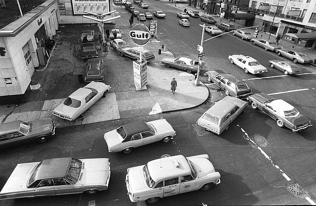 In this Dec. 23, 1973, file photo, cars line up in two directions at a gas station in New York City. Right-on-red was a gas-savings tool during the 1970s oil crisis.
Mandatory Credit:	Marty Lederhandler/AP