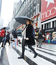 People cross the street outside Macy's Herald Square store in December 2023. Macy’s has rejected a $5.8 billion offer to take the 165-year-old retailer private.
Mandatory Credit:	Kena Betancur/VIEWpress/Corbis/Getty Images