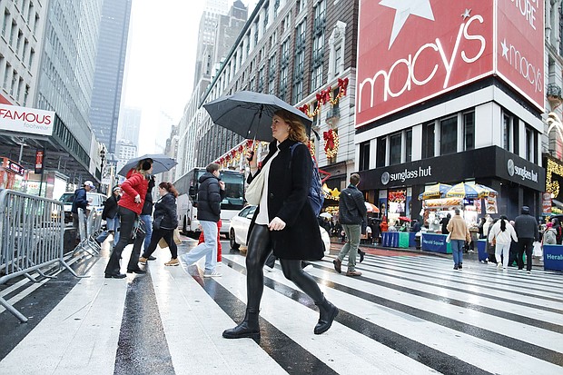 People cross the street outside Macy's Herald Square store in December 2023. Macy’s has rejected a $5.8 billion offer to take the 165-year-old retailer private.
Mandatory Credit:	Kena Betancur/VIEWpress/Corbis/Getty Images
