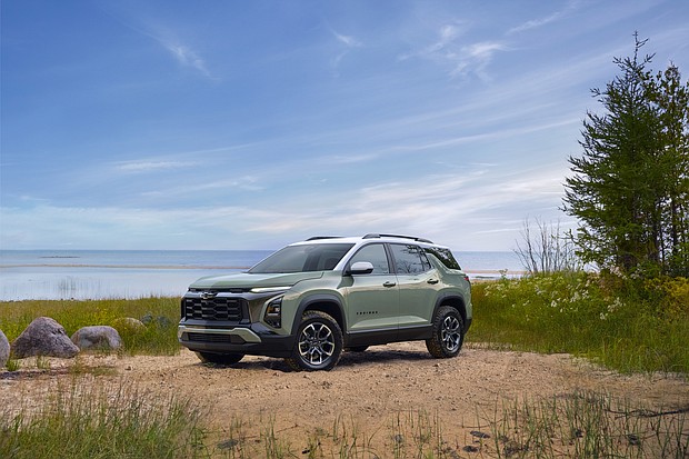 Front 3/4 view of a 2025 Chevrolet Equinox ACTIV in Cacti Green parked in front of a lake. Preproduction model shown. Actual production model may vary. Model year 2025 Chevrolet Equinox available 2024.