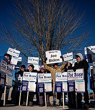 Attendees hold signs during a Write-In Joe Biden campaign "Get Out The Vote" event in Dover, New Hampshire, on January 21. A robocall that appears to be an AI voice resembling Biden is reaching out to New Hampshire residents.
Mandatory Credit:	Al Drago/Bloomberg/Getty Images