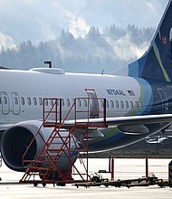 Alaska Airlines N704AL, a 737 Max 9, which made an emergency landing at Portland International Airport on January 5 is parked at a maintenance hanger in Portland, Oregon on January 23. The missing emergency door is covered and taped.
Mandatory Credit:	Patrick T. Fallon/AFP/Getty Image