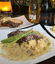 Steak Night at The Savoy features Black Angus Ribeye steaks with scratch-made sides and a choice of sauces for a special price on Thursdays from 4pm-Close.