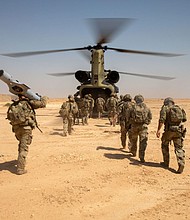 US Army Soldiers board a CH-47 Chinook helicopter after a live-fire exercise at Al Asad Air Base, Iraq, in July 2023.
Mandatory Credit:	Spc. Timothy VanDusen/US Army