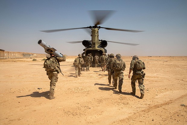 US Army Soldiers board a CH-47 Chinook helicopter after a live-fire exercise at Al Asad Air Base, Iraq, in July 2023.
Mandatory Credit:	Spc. Timothy VanDusen/US Army