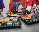 Students select their meals during lunch break in the cafeteria on Dec. 12, 2022, at an elementary school in Scottsdale, Ariz. A bill that would provide free meals for all public school students in Virginia passed the Senate Education and Health Committee last week. The proposal would cost an estimated $346 million over the next two years.