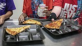 Students select their meals during lunch break in the cafeteria on Dec. 12, 2022, at an elementary school in Scottsdale, Ariz. A bill that would provide free meals for all public school students in Virginia passed the Senate Education and Health Committee last week. The proposal would cost an estimated $346 million over the next two years.