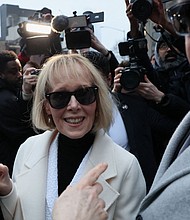 E. Jean Carroll enters a car as she leaves the courthouse on Friday. Brendan McDermid/Reuters