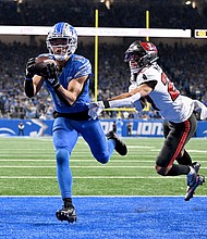 St. Brown catches a touchdown against Tampa Bay Buccaneers cornerback Zyon McCollum during the second half of their NFC divisional round playoff game.
Mandatory Credit:	Lon Horwedel/USA TODAY Sports/Reuters