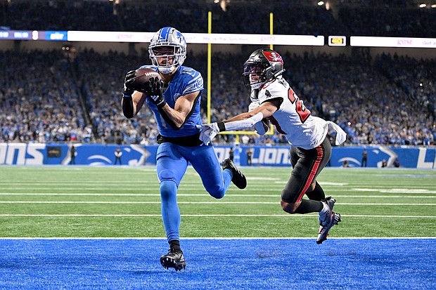 St. Brown catches a touchdown against Tampa Bay Buccaneers cornerback Zyon McCollum during the second half of their NFC divisional round playoff game.
Mandatory Credit:	Lon Horwedel/USA TODAY Sports/Reuters