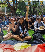 Protesters carry the Aboriginal flag as Indigenous leaders speak about the injustices inflicted through colonization.
Mandatory Credit:	Jenny Evans/Getty Images