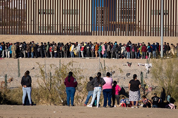 Migrants wait in front of barbed wire in Ciudad Juarez, Mexico on December 29, 2023.
Mandatory Credit:	David Peinado/Anadolu/Getty Images