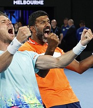 Rohan Bopanna and Matthew Ebden celebrate winning the men's doubles final at the Australian Open.
Mandatory Credit:	Ciro De Luca/Reuters